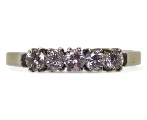 A white metal five stone diamond ring, set with estimated approx 0.25cts size N, weight 2.4gms Condition Report:Available upo