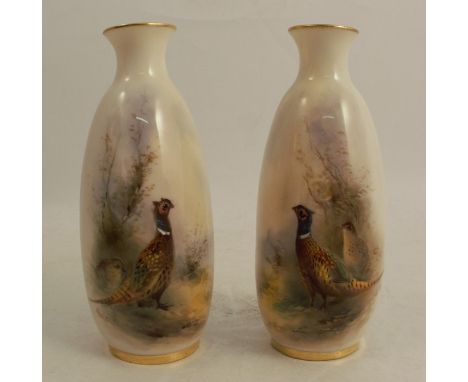 A pair of Royal Worcester vases, decorated to the front with pheasants in landscape by Jas Stinton, shape number 2491, dated 