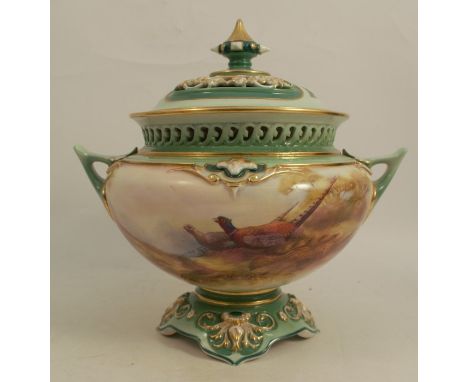 A Royal Worcester covered pot pourri vase, painted with pheasants in a landscape, signed W E Jarman, dated 1910, height 7.5in