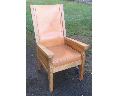 &nbsp;A Robert Mouseman Thompson oak and leather armchair, with leather back panel and cushion, height 45ins, seat depth 22in