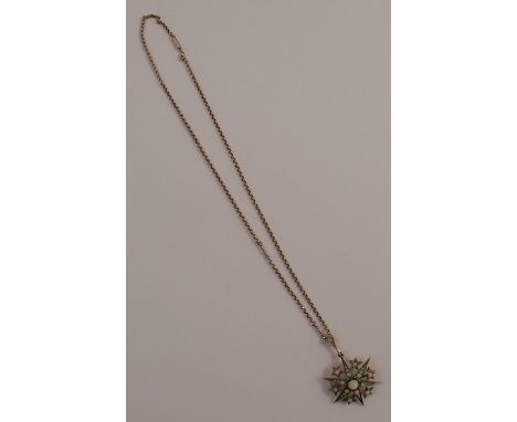 A late Victorian opal set starburst pendant brooch, tagged '9ct', 3.3cm across, on a chain 44cm long, 8g gross