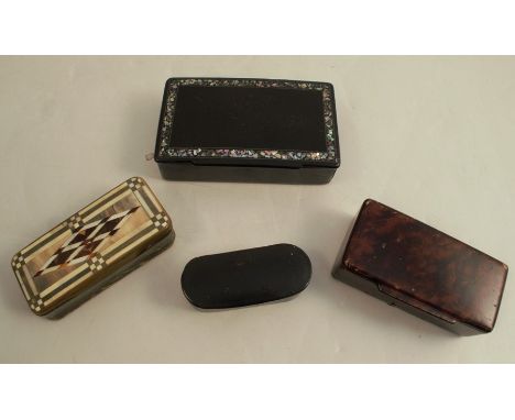 A 19th century Georgian horn snuff box, with a geometric parquetry top, together with three papier mache snuff boxes