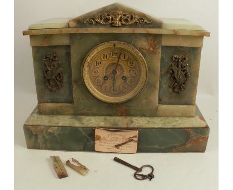 A late Victorian green marble mantel clock, or architectural form, with gilt metal mounts, the gilt metal dial having a strik