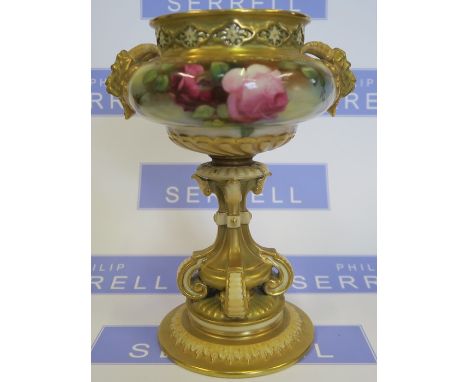 A Royal Worcester vase, with pierced rim, mask handles, the body decorated with roses, raised on a pedestal to a circular bas