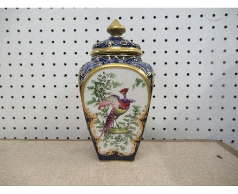 A Royal Worcester Grainger &amp; Co pot pourri, decorated with panels of birds, to a scale blue ground, height 7ins