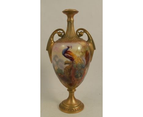 A Royal Worcester two handled vase, decorated with a peacock in a tree, signed J Southall, shape number H248, height 10insCon