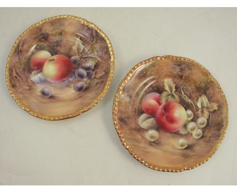 A pair of Royal Worcester plates, decorated with fruit to a mossy background by P Love, dated 1953, diameter 6insCondition Re
