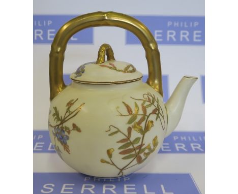 A Royal Worcester gilded ivory tea pot, with bamboo handle and finial, decorated with flowers, dated 1906, height 6.5ins