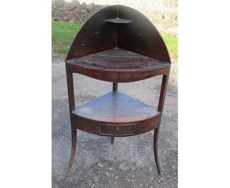 A 19th century mahogany corner wash stand, fitted with a drawer to the lower shelf, height 43ins