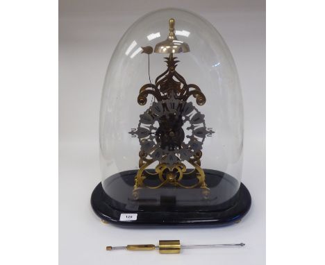A 19thC lacquered brass skeleton clock of scrolled design; the single fusee, bell strike movement faced by an engraved and pi