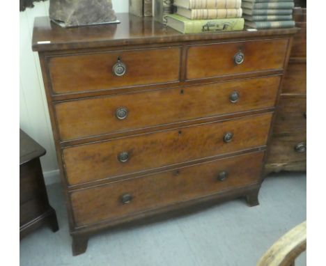 A mid 19thC mahogany dressing chest with two short/three graduated long drawers, cockbeading and brass handles, raised on spl