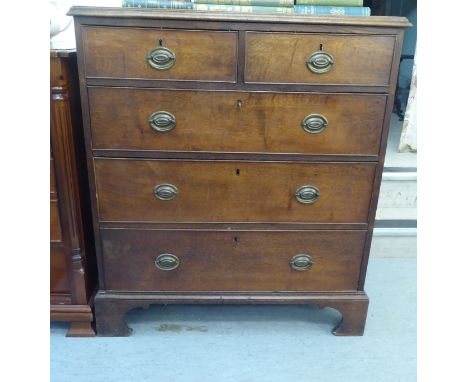 A 19thC oak dressing chest with two short/three graduated long drawers and brass bail handles, raised on bracket feet&nbsp; 4