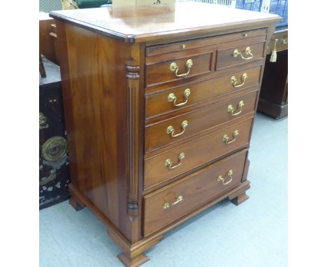 A modern mahogany facsimile dressing chest with a rise-and-slide action, raised on bracket feet&nbsp; 38"h&nbsp; 32"w 