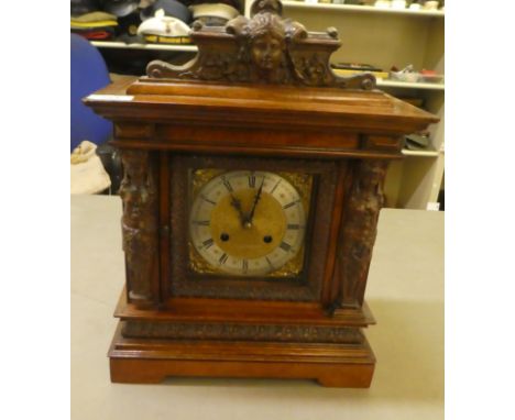 An early 20thC (possibly German), mahogany cased mantel clock; the movement faced by a steel Roman dial, on a bracket plinth&