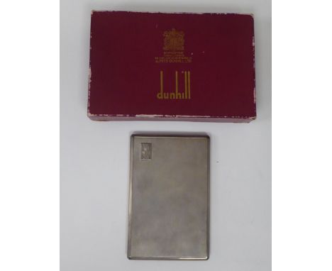 A Dunhill silver folding cigarette case with engine turned decoration and a sliding clasp&nbsp; London 1960&nbsp; boxed 