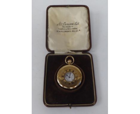 A 9ct gold cased half hunter pocket watch, the keyless movement faced by a white enamel Roman dial, incorporating a subsidiar
