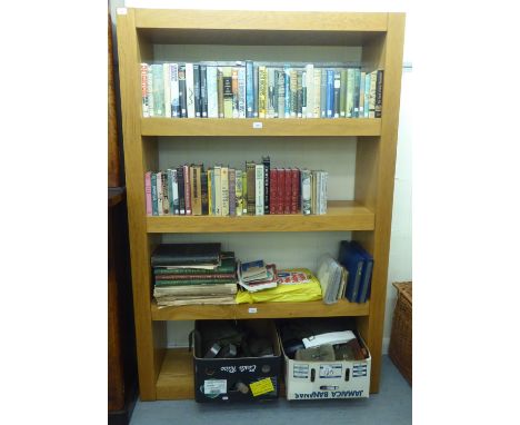 A modern light oak finished four tier open bookcase, on a plinth&nbsp; 71"h&nbsp; 48"w&nbsp; 