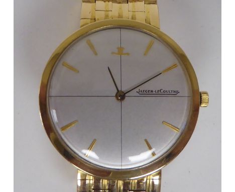 A 1960s Jaeger LeCoultre model 1901 18ct gold, ultra-slim cased mechanical bracelet wristwatch, faced by a gilded baton dial 
