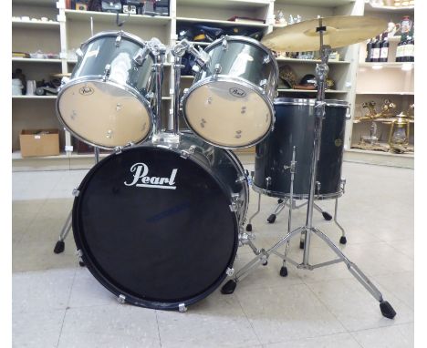 A Pearl Forum Series five piece drum kit with seat and drumsticks 