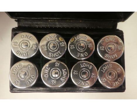 A set of eight numbered, clear glass 'One Shot' butt markers with threaded silver caps, fashioned as 12 bore cartridges&nbsp;