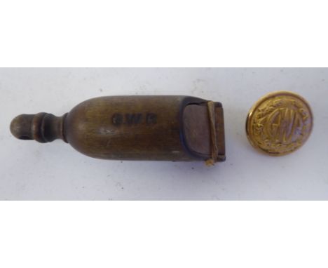 A 19thC Great Western Railway guards wooden whistle with an impressed mark; and a later GWR Compton Sons &amp; Webb, London g