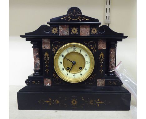 A late Victorian slate and marble cased mantel clock of architectural form; the movement faced by an Arabic dial, on a plinth