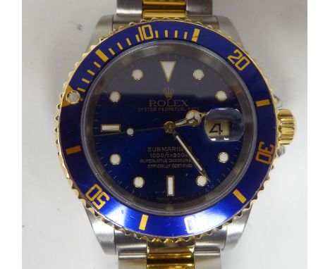 A Rolex Submariner 16613, bi-coloured&nbsp;stainless steel cased chronometer, the blue dial with a rotating bezel, faced by a