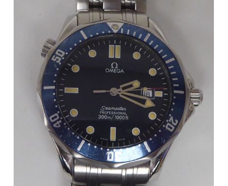An Omega Seamaster 300m blue titanium and stainless steel cased bracelet wristwatch, faced by a black baton dial, incorporati