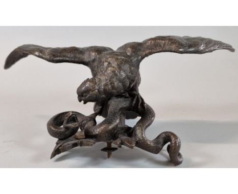 Patinated bronze study of an eagle with snake. 22cm wide approx. (Probably mount from a clock).  (B.P. 21% + VAT)