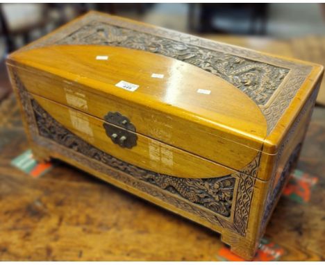 Chinese hardwood carved dragon design miniature camphor wood chest. 56x28x30cm approx. (B.P. 21% + VAT)