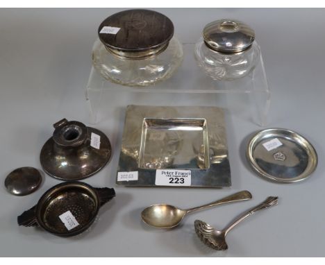 Box of silver items to include: capstan inkwell, glass dressing table jars with silver covers, square ash tray, spoons etc. (