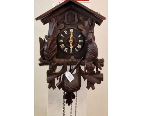 20th century carved wooden stained Bavarian Cuckoo Clock with weight, chains and pendulum. (B.P. 21% + VAT)&nbsp;&nbsp;NO IN-