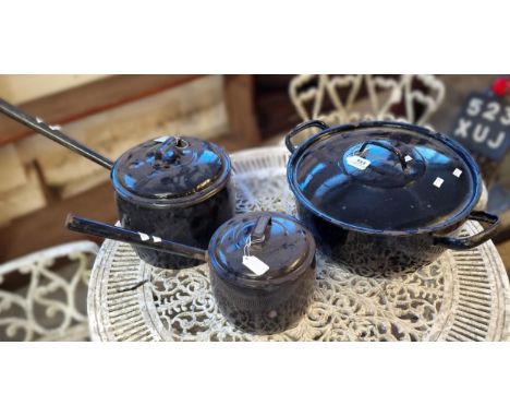 Two similar vintage enamel lidded saucepans together with a larger circular two handled lidded pan. (3) (B.P. 21% + VAT)&nbsp