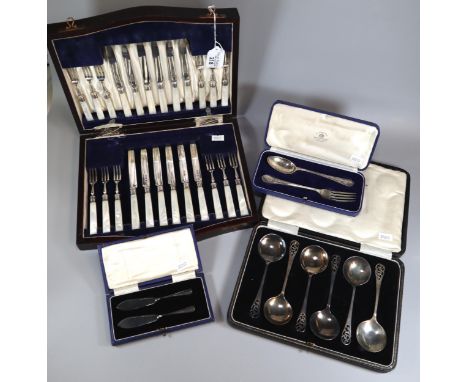 Collection of cased silver to include: pair of butter knives, christening spoon and fork set, set of six spoons (6.8 troy oz 