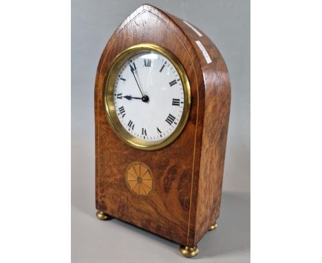 Edwardian inlaid walnut lancet shaped mantle clock with ceramic Roman dial and brass bun feet. French brass drum movement. 23
