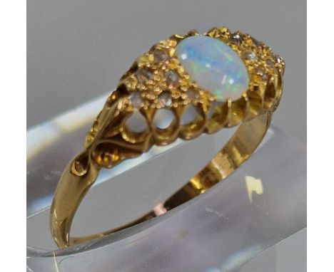 18ct gold opal cabochon ring inset with tiny diamond chips. 2.4g approx. Size P. (B.P. 21% + VAT)