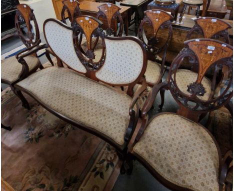 Edwardian mahogany inlaid and mixed woods parlour suite comprising: large two seater sofa, pair of carver chairs and a set of
