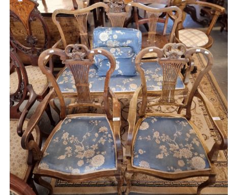 Edwardian stained parlour suite comprising: two seater sofa and a pair of open armchairs, all with lyre back design and flora