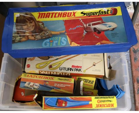 Plastic tub of vintage games to include: Mattel Sizzlers U-Turn Pac, Matchbox Superfast Curve Pack and similar accessories. (
