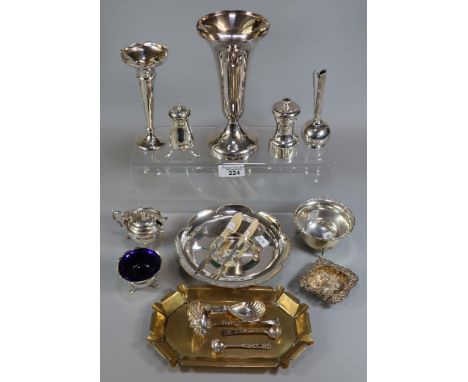 Wicker basket containing assorted silver and silverplate to include: silver salt, silver sucrier, mustard pot, pepperette, pe