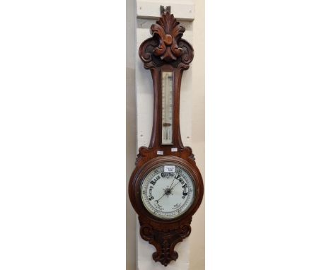 Early 20th century carved oak banjo aneroid barometer.  (B.P. 21% + VAT)