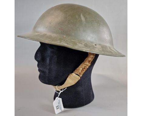 British Military steel helmet with painted finish and original liner. Post WWII. (B.P. 21% + VAT).&nbsp;Images of inside of h
