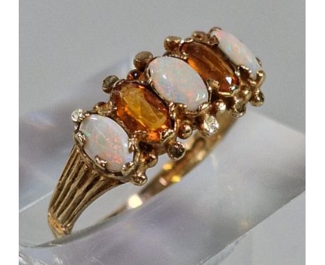 9ct gold orange and opal five stone ring. 1.7g approx. Size L1/2. (B.P. 21% + VAT)