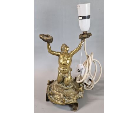 Probably 19th century bronze study of a Merman rising from the waves on a C-scroll cast base, now as a lamp holder. 24cm high