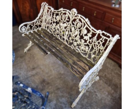 Coalbrookdale style cast metal garden bench, with teak slats. (B.P. 21% + VAT)&nbsp; Weathered condition - one slat broken an