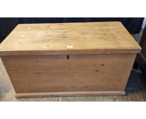 Late Victorian pine trunk with metal loop carrying handles of plain rectangular form. (B.P. 21% + VAT)&nbsp;&nbsp;Lock missin