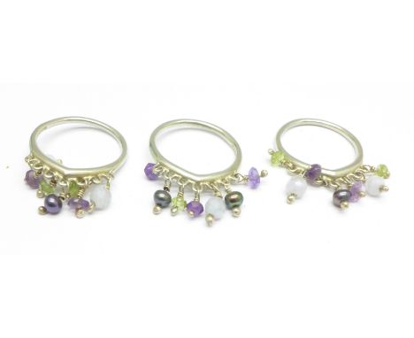 A Dower and Hall silver three ring stacker, peridot, amethyst and pearl, M
