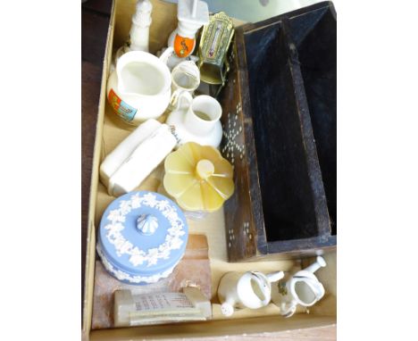 A collection of crested ware, a desk calendar/pen stand, a novelty brass rocking chair thermometer, a Wedgwood Jasperware lid