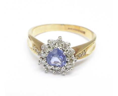 A 9ct gold, diamond and blue stone ring, 2.3g, K