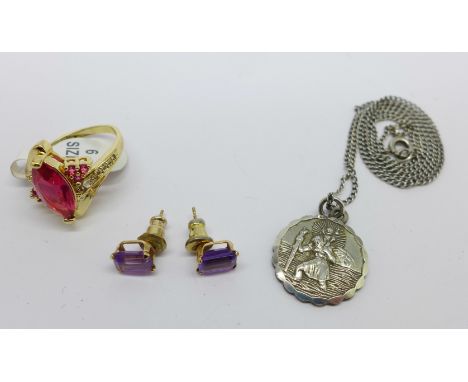 A pair of yellow metal set amethyst earrings, with plated backs, a stone set ring marked 925 and a silver St. Christopher pen